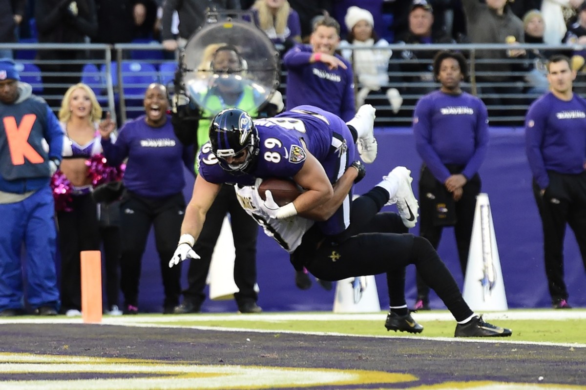Baltimore Ravens tight end Mark Andrews (89) runs through New Orleans Saints cornerback Marshon Lattimore (23) for a touchdown. Mandatory Credit: Tommy Gilligan-USA TODAY Sports